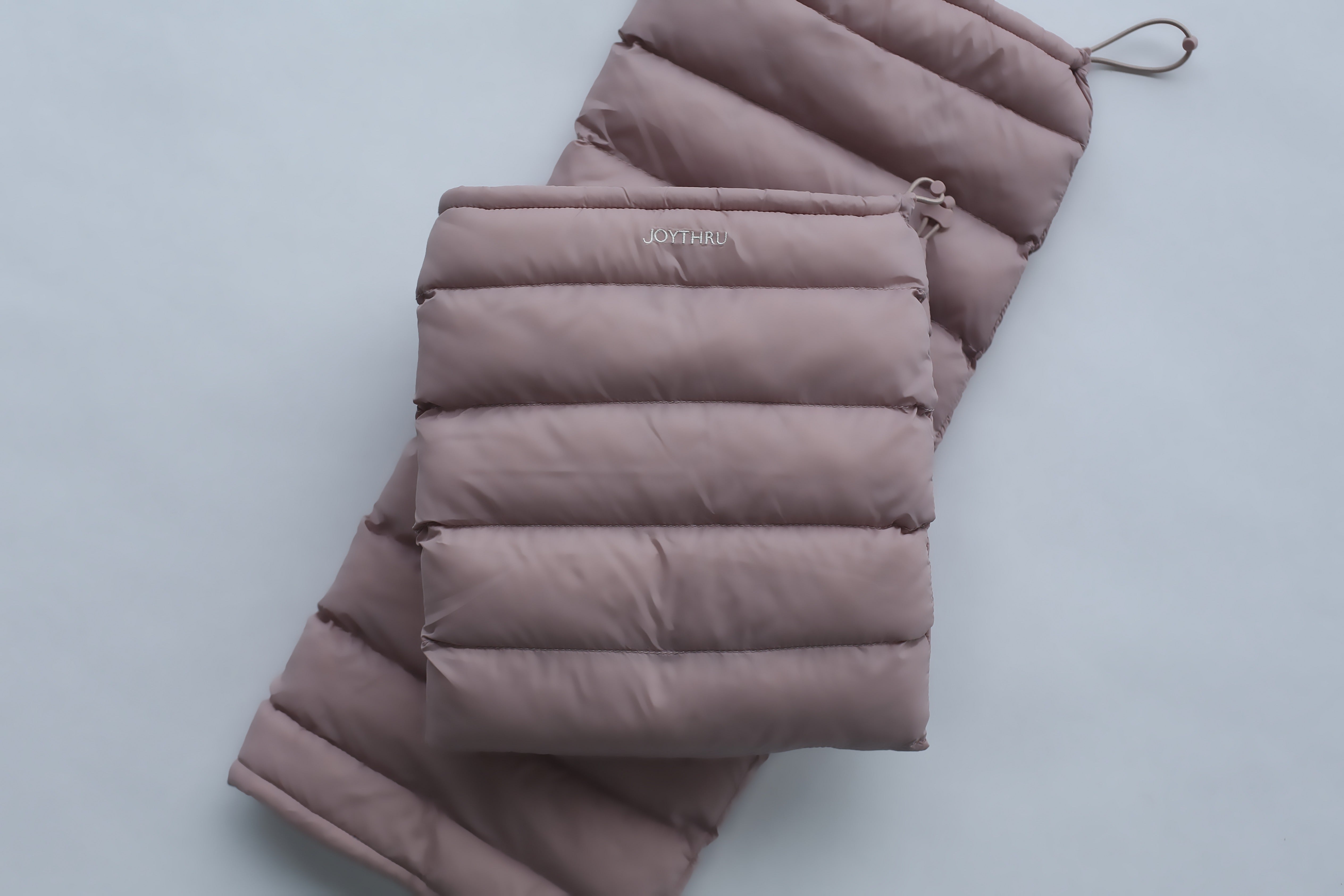 Mauve LegPuffs folded, flatlay with JoyThru logo