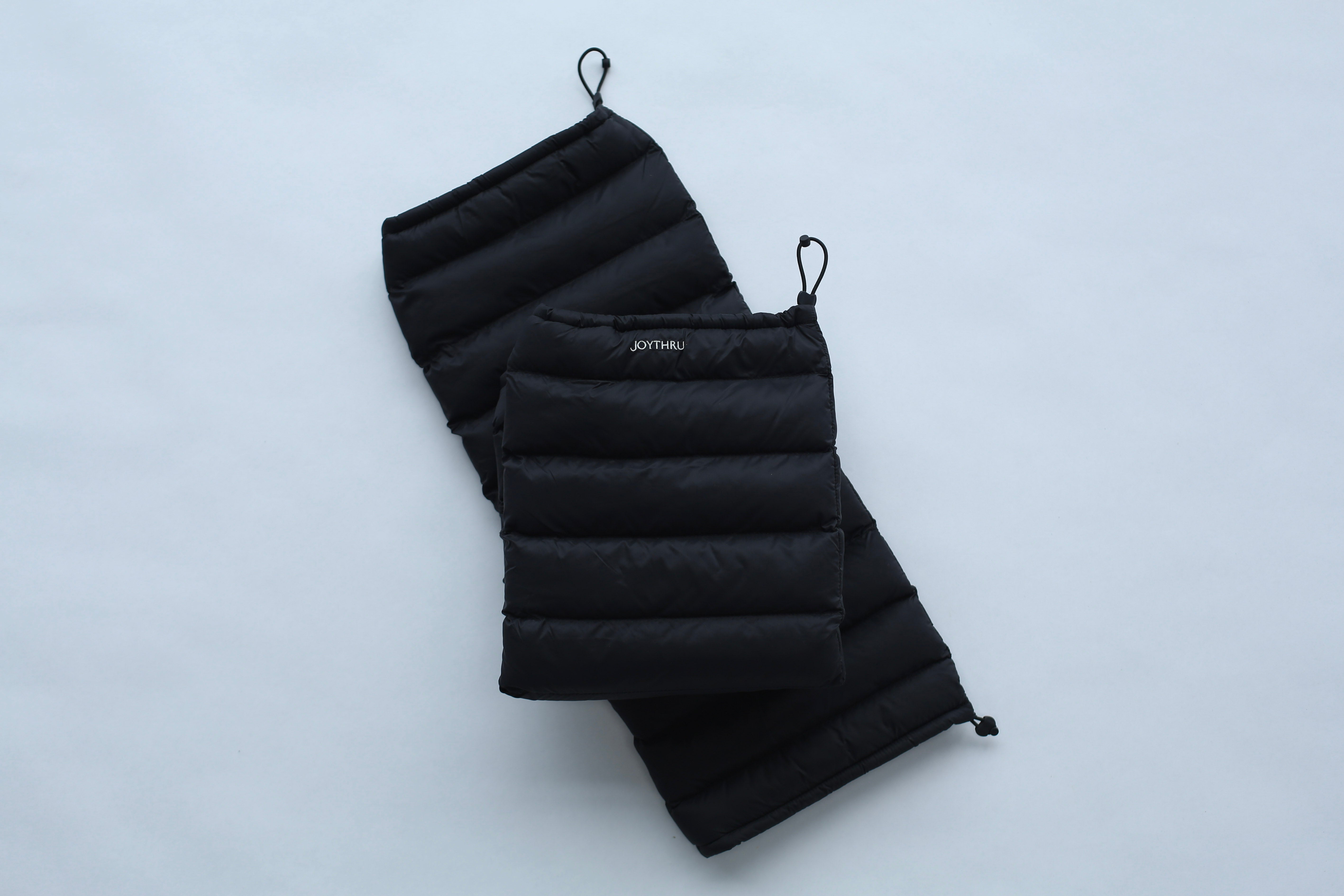 Onyx LegPuffs folded, flatlay on white