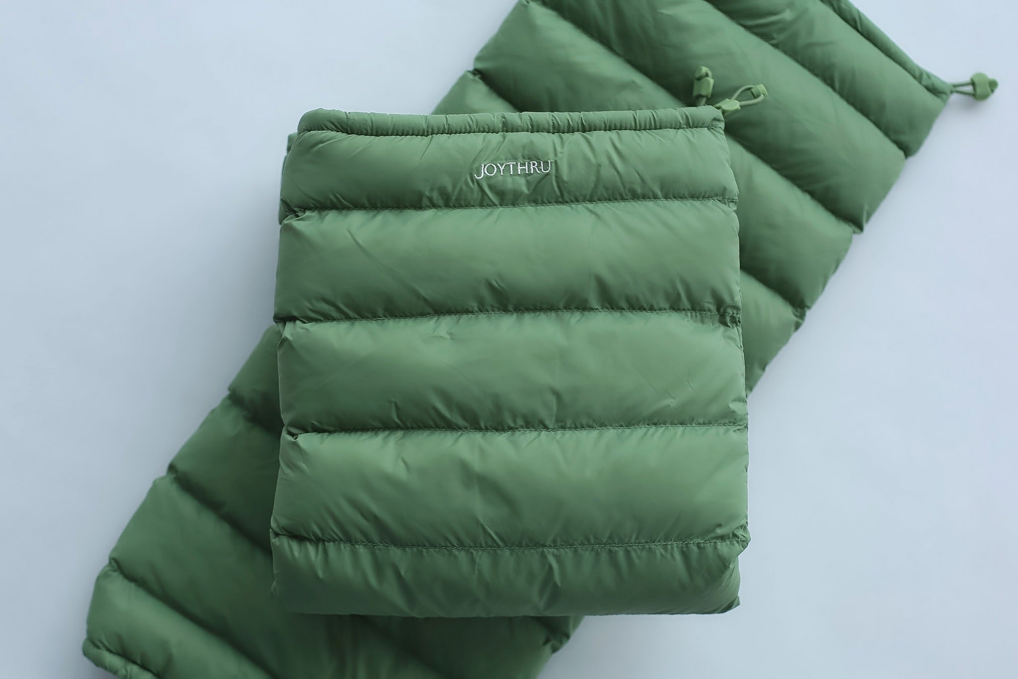 Sage LegPuffs folded pair with JoyThru embroidery, flatlay