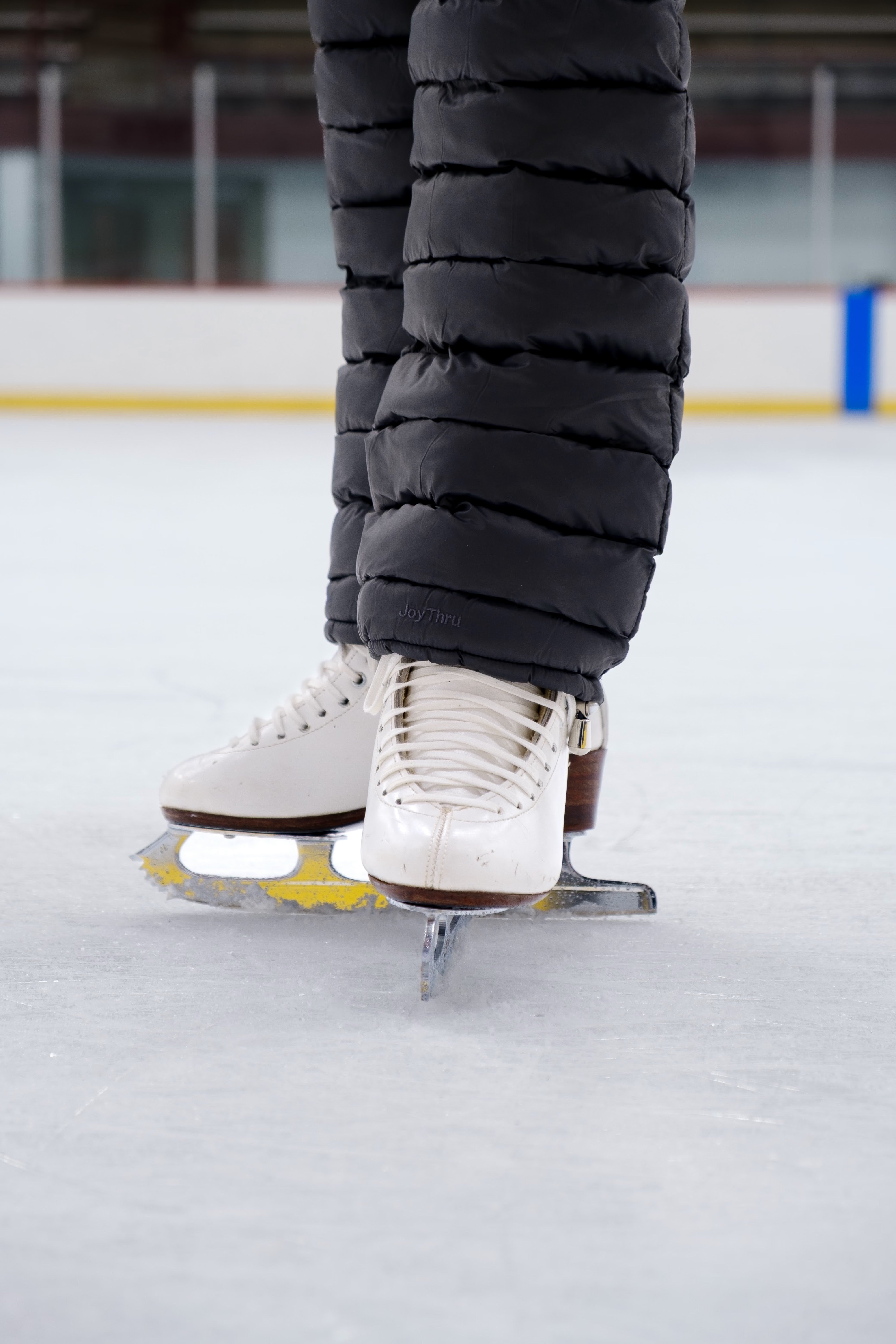Close-up of Onyx LegPuffs worn with figure skates