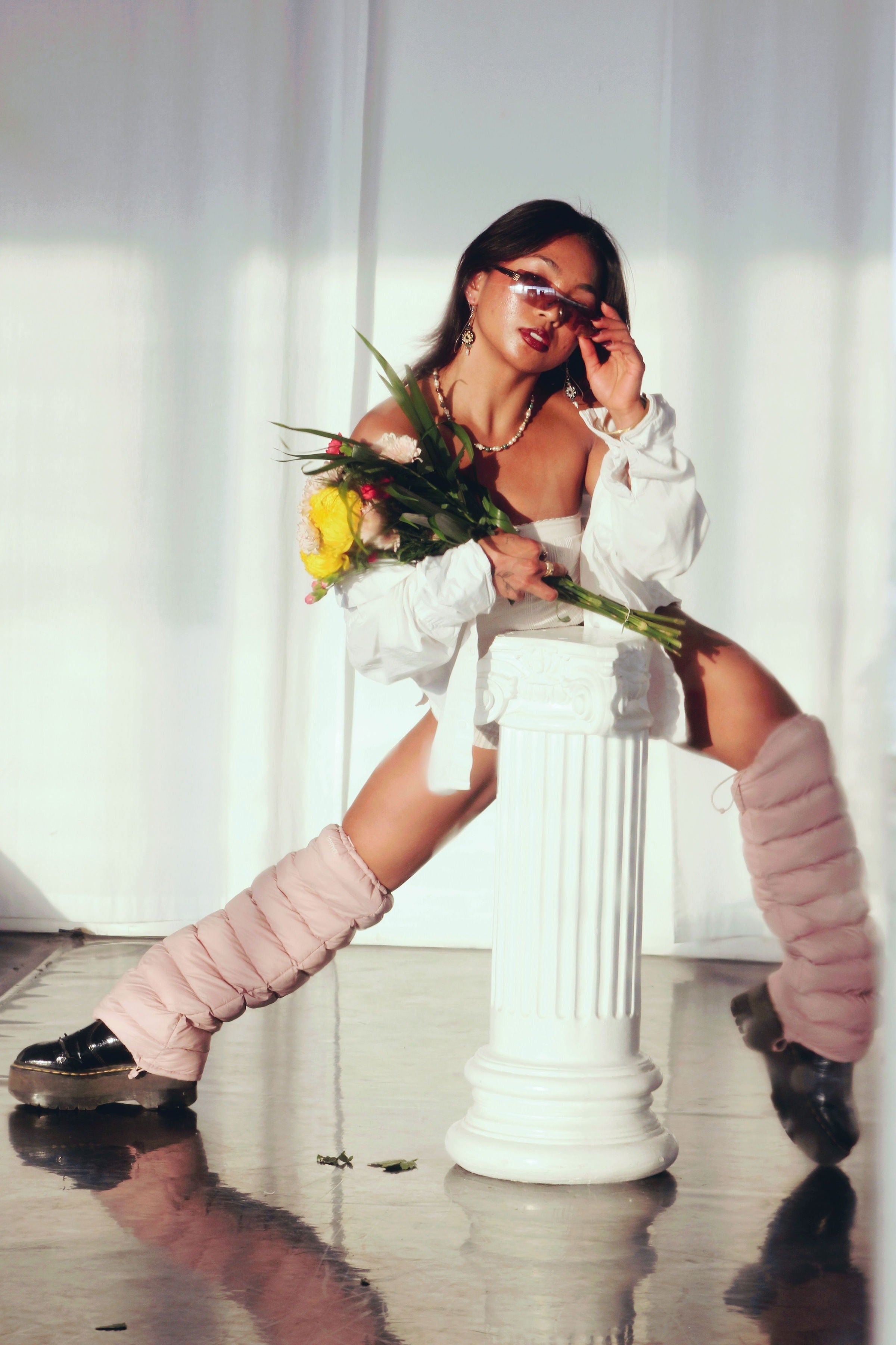 Model with flowers wearing Mauve LegPuffs and platform boots