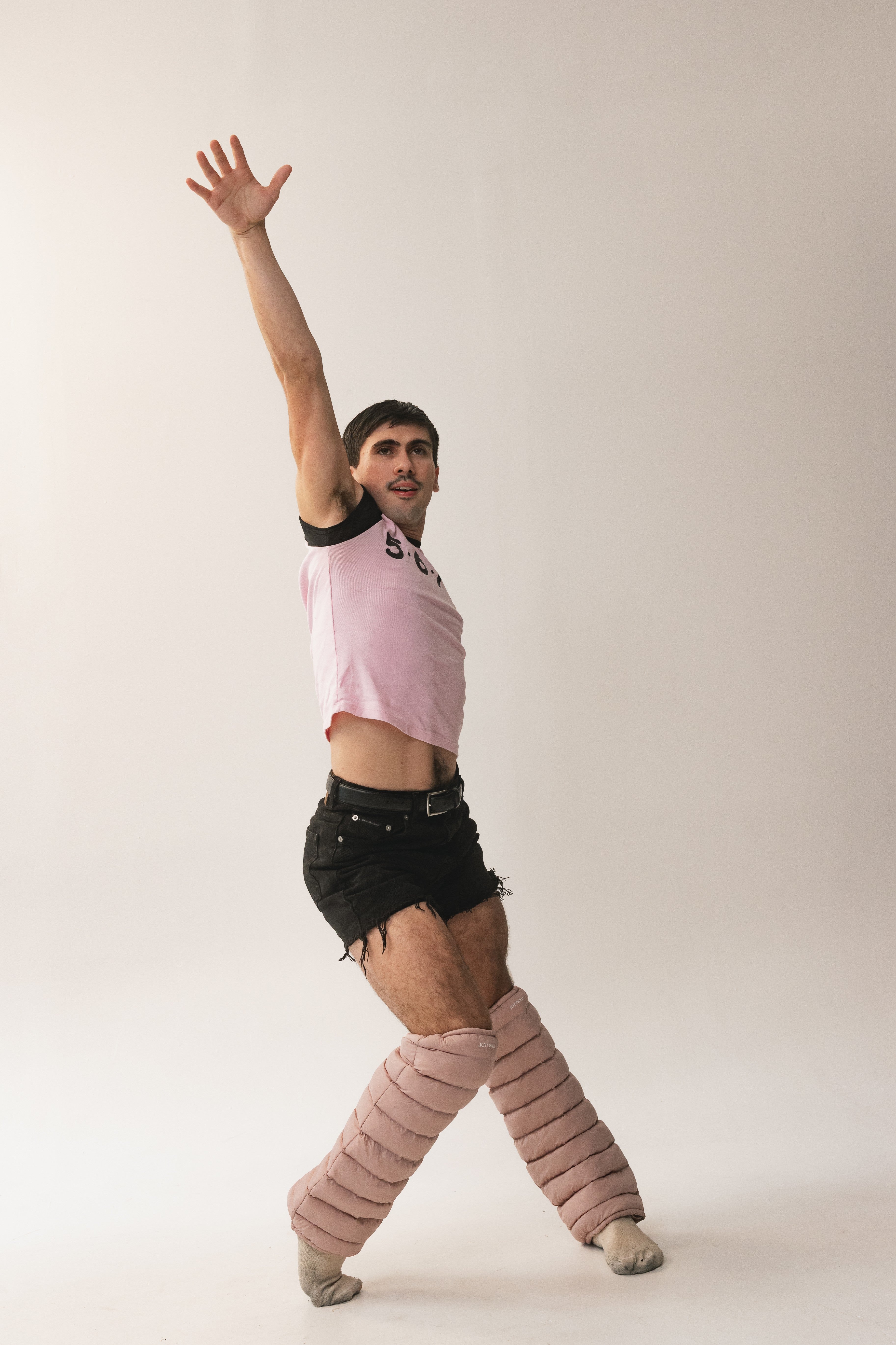 Dancer reaching upward wearing Mauve LegPuffs
