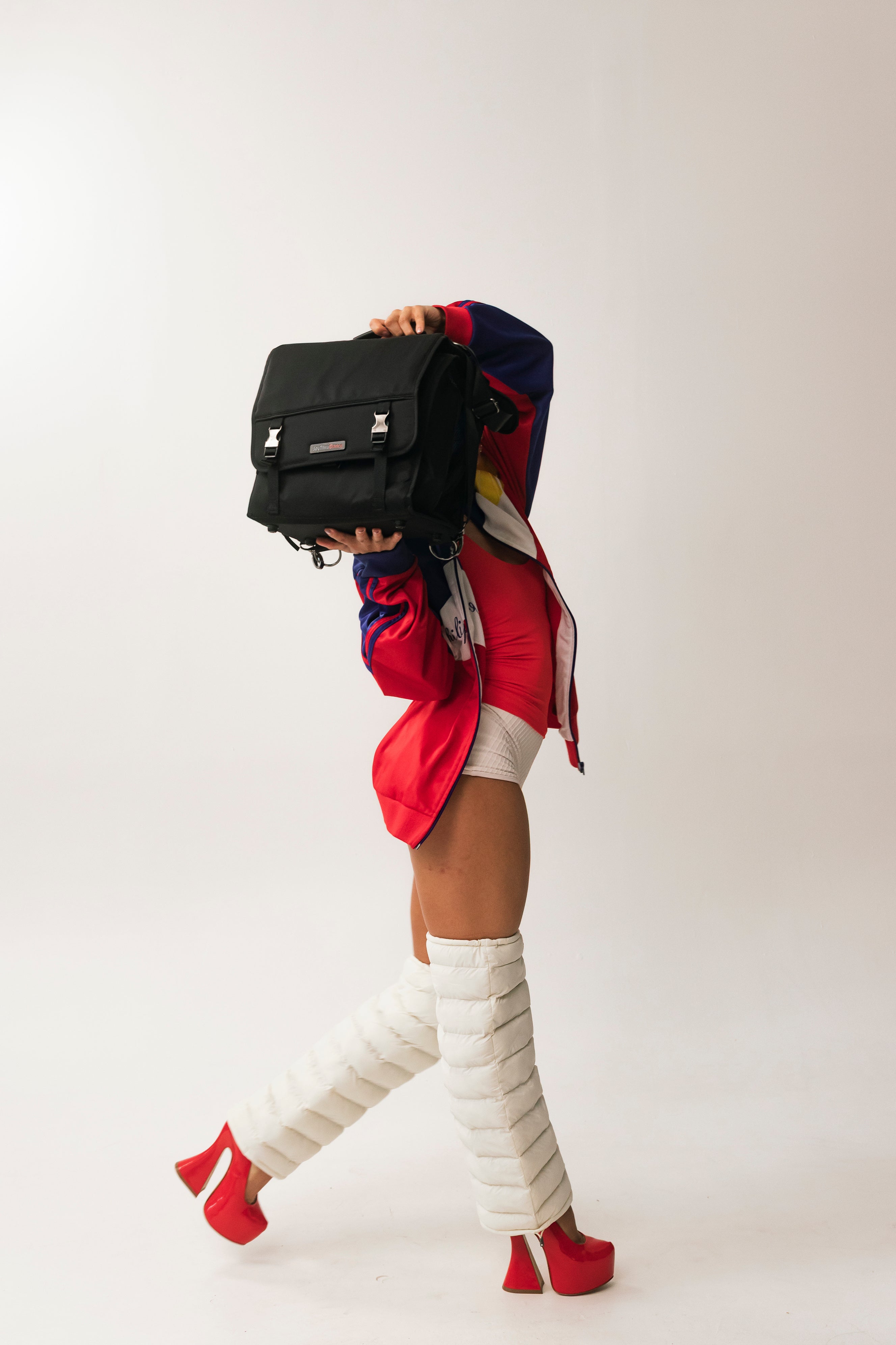 Model walking in Frost LegPuffs with the JoyThru Dance Bag