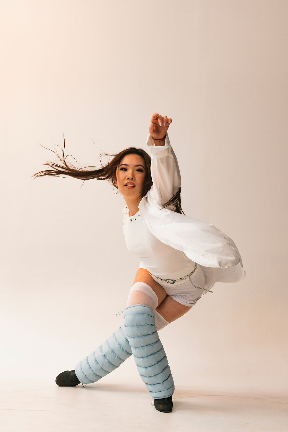 Dancer mid-movement wearing sky LegPuffs