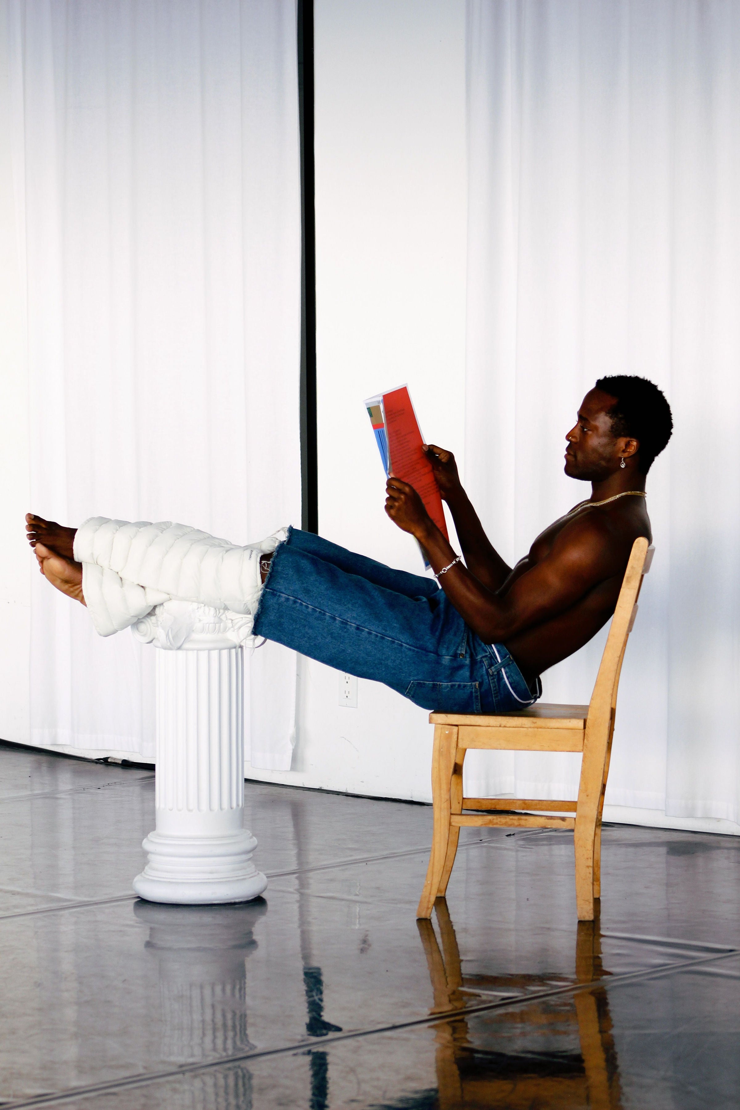 Model reading with Frost LegPuffs resting on a column