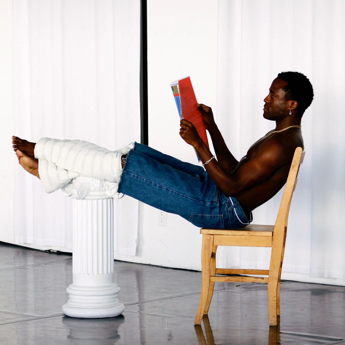 Model reading with Frost LegPuffs resting on a column