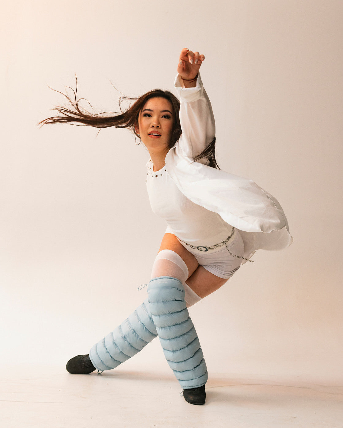 Dancer mid-movement wearing Sky LegPuffs